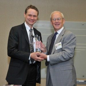 Northrop Grumman Chairman, CEO and President Wes Bush (left) accepts an award for “Commercial Business Partnership in support of the AbilityOne Program” from Bob Chamberlin, CEO and President of SourceAmerica.