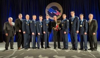 The winning team and coaches of the National Champion title for the All Service Division at the CyberPatriot VI Finals Competition in March, 2014. The team, the “Fearsome Falcons,” hails from Clearfield High School in Utah. 