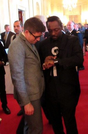 Rapper William Adams (will.i.am) shows off a gadget at the 2014 White House Maker Faire.