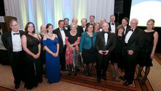 The Community Foundation for Northern Virginia awarded the 2014 Community Leadership Award to Richard Duvall (second from right), and Holland & Knight LLP for their philanthropic leadership and dedication to community service in the region at the Sweet Home Virginia Gala on 10-10-14.  Stuart Mendelsohn (forth from right) served as the Gala co-chair. They are joined by family and other members of the Holland & Knight law firm.