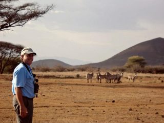 Stan Soloway on the ranch, wandering to the zebras