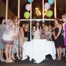 Bite Me Cancer founder Nikki Ferraro (center) is surrounded by fellow cancer survivors during the cake cutting at the third annual “Cancerversary” Dinner, held April 23, 2016, at the Tower Club in Tysons Corner, Va. Photo courtesy Bite Me Cancer.