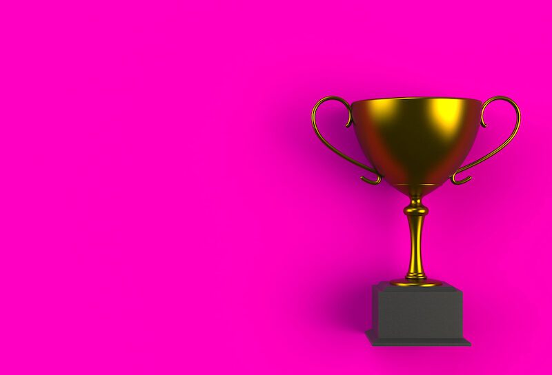 Trophy on pink plank, 3D rendering