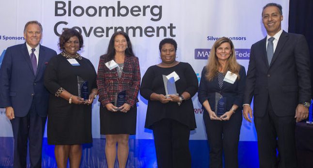 Mike Rogers (left) with Executive Assistant of the Year award winners Coney Jackson Elam, Nancy Edwards, Groslyn Burton, Pennie Parkin and WashingtonExec's JD Kathuria. Image: WashingtonExec